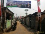 Spanduk ucapan terima kasih warga dan pengurus RT 07/16 Kapuk atas pembangunan Saluran Lingkungan di Jalan H Tabar.
