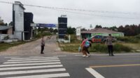 Polres Humbahas melaksanakan Strong Point pagi di titik rawan kecelakaan dan kemacetan untuk menjaga keamanan, kelancaran lalu lintas, serta mendukung Operasi Zebra Toba 2025.